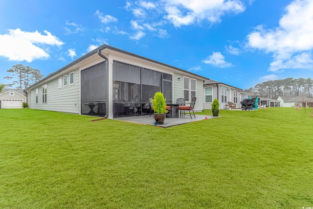 back of property featuring a patio, a lawn, a residential view, and a sunroom