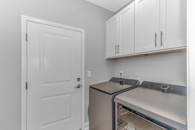 laundry room featuring cabinet space and washing machine and clothes dryer