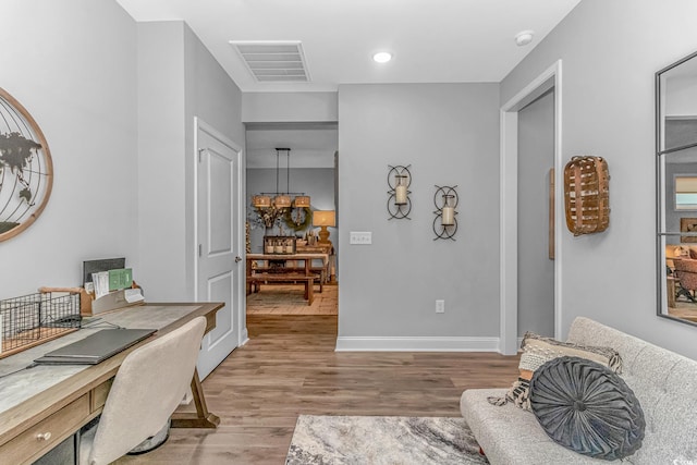 office area with baseboards, visible vents, wood finished floors, and recessed lighting