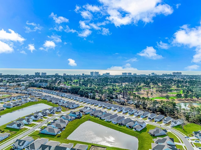 aerial view with a residential view, a water view, and a view of city