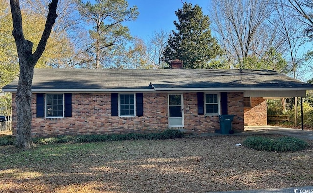 single story home featuring a carport