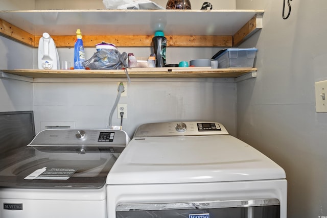 clothes washing area with independent washer and dryer