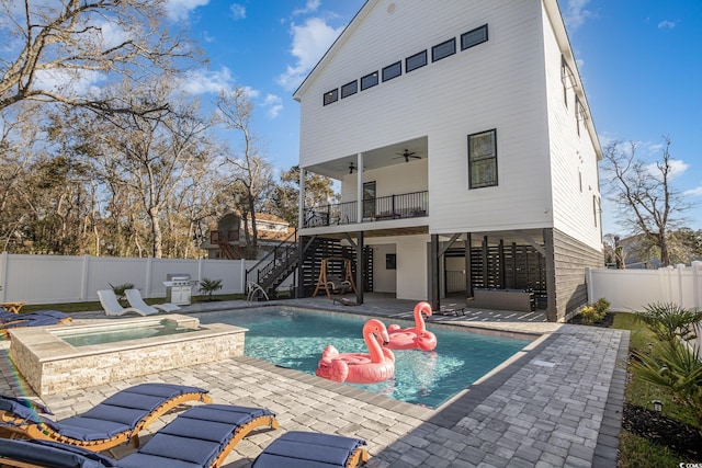 view of swimming pool featuring ceiling fan, grilling area, an in ground hot tub, and a patio