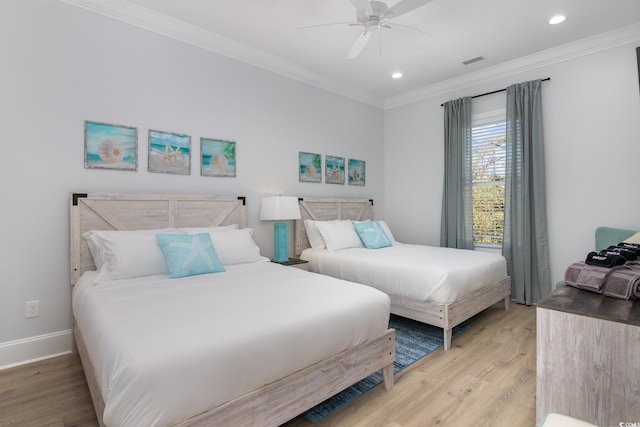 bedroom featuring light hardwood / wood-style floors, ceiling fan, and ornamental molding