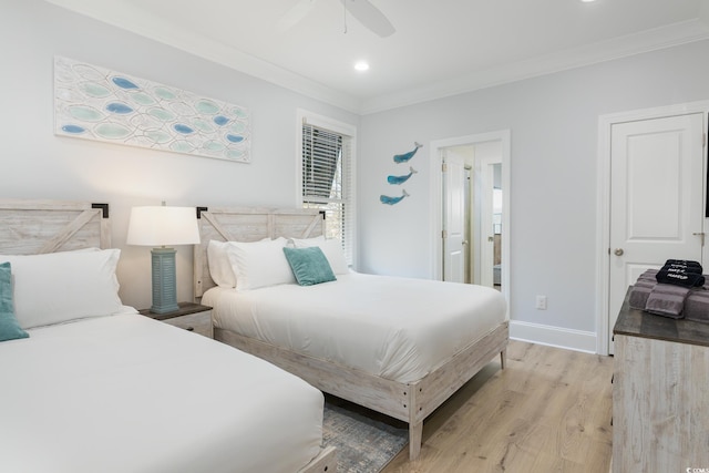 bedroom featuring ceiling fan, crown molding, ensuite bathroom, and light hardwood / wood-style flooring