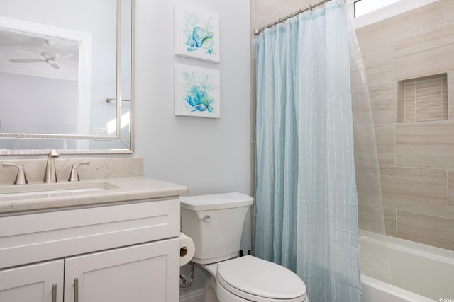 full bathroom with vanity, shower / bathtub combination with curtain, toilet, and ceiling fan