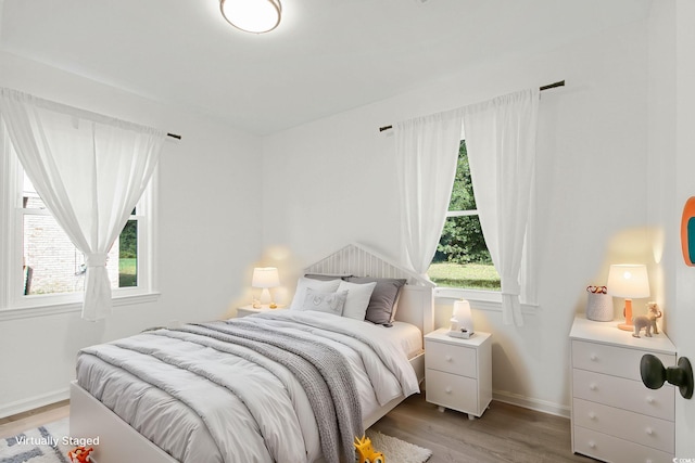 90 Wateree Trl, Georgetown, SC 29440 - bedroom with baseboards, multiple windows, and light wood finished floors