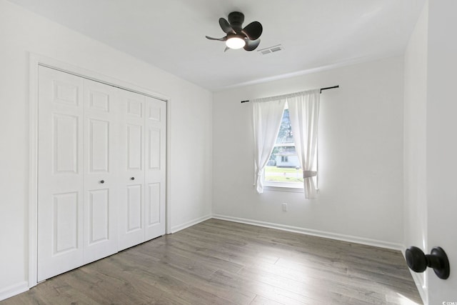 90 Wateree Trl, Georgetown, SC 29440 - unfurnished bedroom featuring ceiling fan, a closet, visible vents, wood finished floors, and baseboards