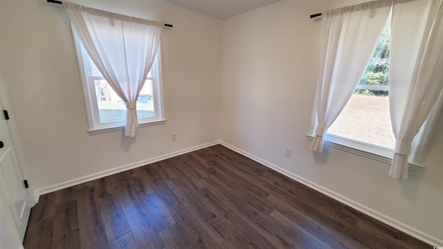 unfurnished room featuring dark hardwood / wood-style floors