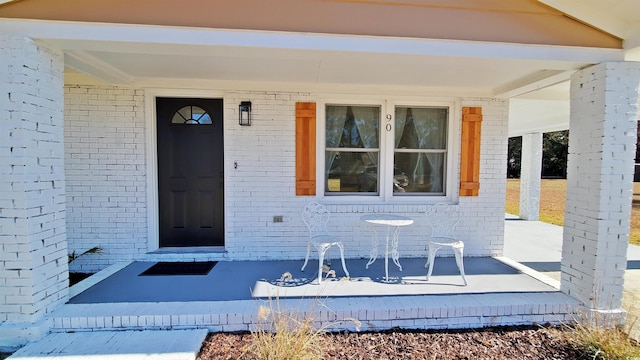 doorway to property featuring covered porch