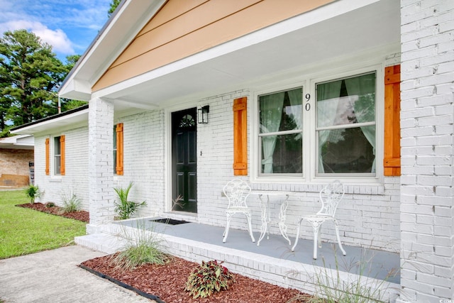 90 Wateree Trl, Georgetown, SC 29440 - property entrance with brick siding and a porch