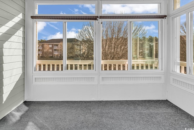 unfurnished sunroom featuring a wealth of natural light