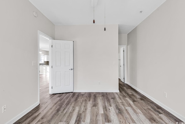 empty room featuring hardwood / wood-style flooring