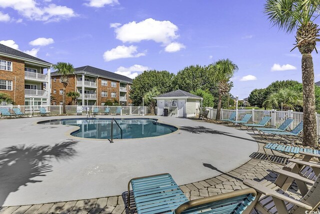 view of pool featuring a patio