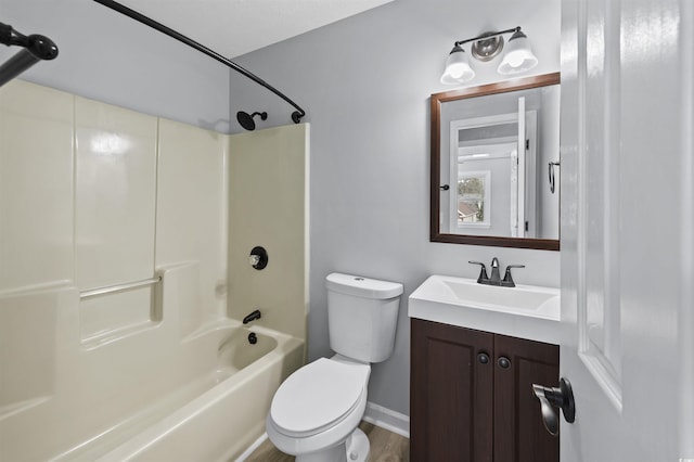 bathroom featuring shower / bath combination, vanity, and toilet