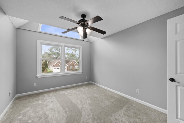 additional living space with carpet floors, vaulted ceiling, and ceiling fan