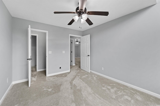 unfurnished bedroom featuring ceiling fan, carpet floors, and baseboards