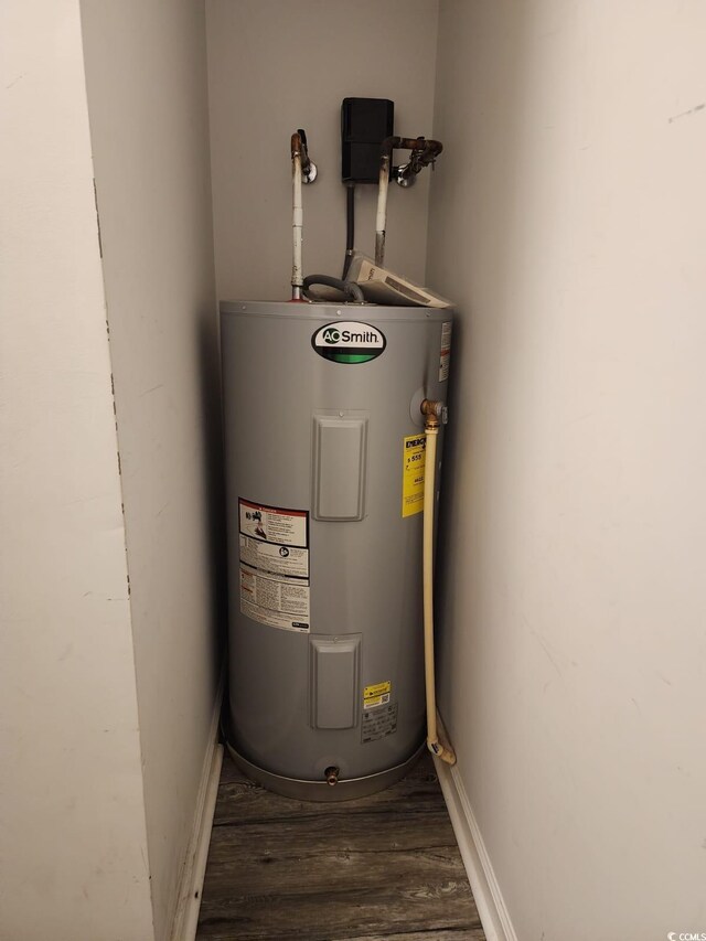 utility room with water heater