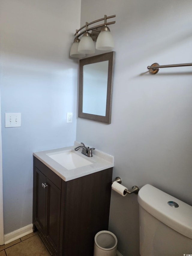 bathroom with tile patterned floors, vanity, and toilet