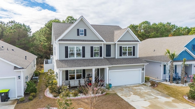 view of front of house featuring a garage, driveway, a porch, and a shingled roof