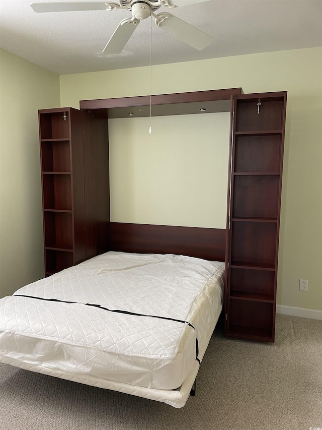 unfurnished bedroom with carpet and ceiling fan