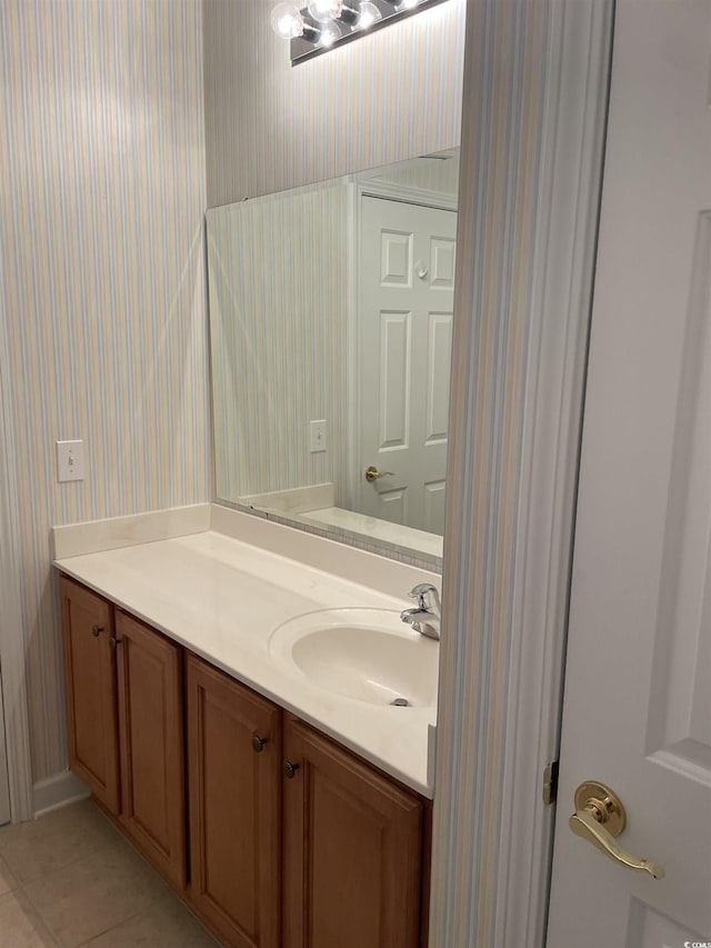 bathroom with tile patterned floors and vanity