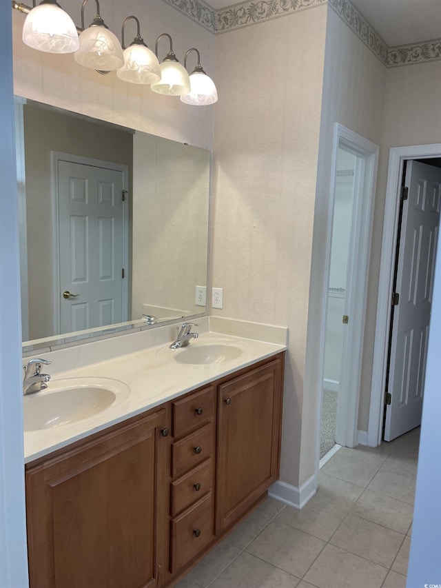 bathroom with tile patterned flooring and vanity