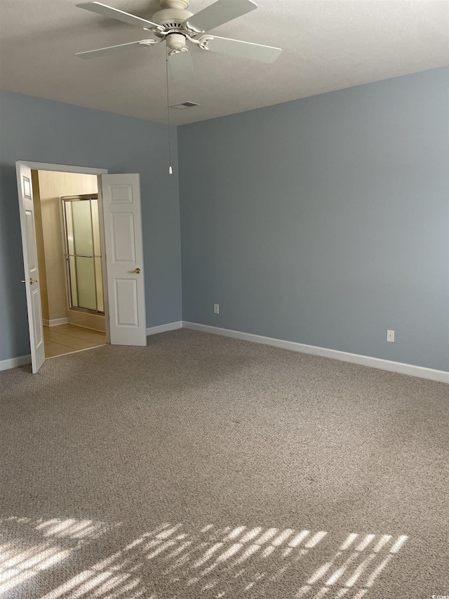 unfurnished bedroom featuring carpet and ceiling fan