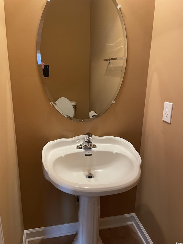 bathroom featuring toilet