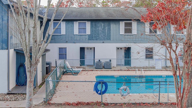 view of swimming pool featuring a patio area and central AC unit