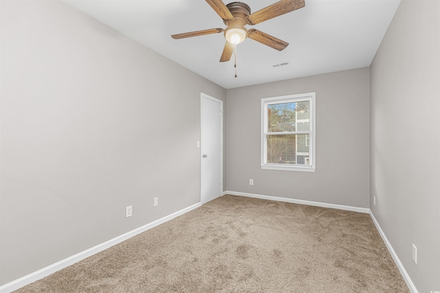 unfurnished bedroom featuring ceiling fan and carpet