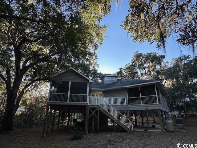 rear view of house with a sunroom