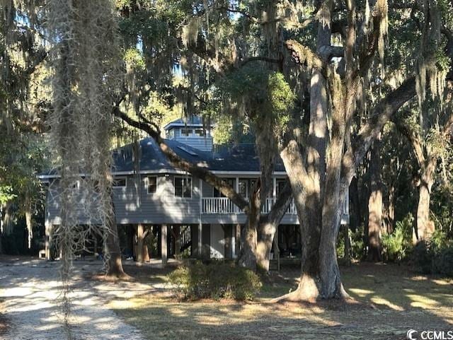 back of property featuring a carport