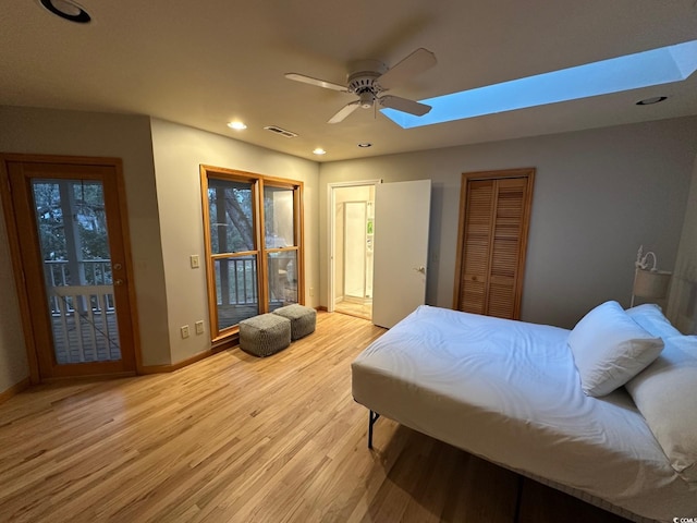 bedroom with ceiling fan and light wood-type flooring