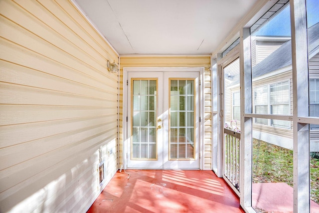 unfurnished sunroom featuring french doors