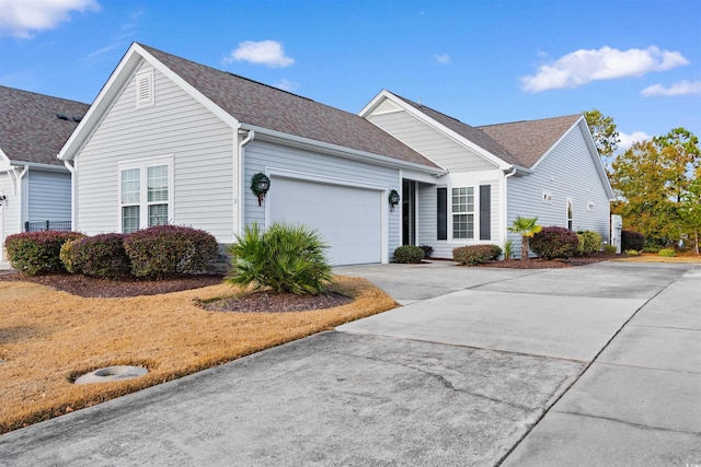 ranch-style home featuring a garage