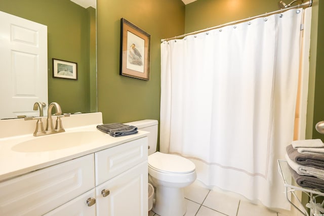 bathroom with vanity, tile patterned floors, and toilet