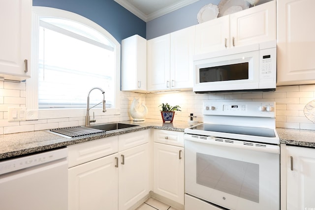 kitchen featuring sink, white cabinetry, crown molding, light stone counters, and white appliances