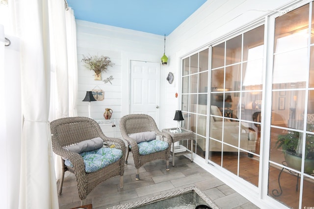 sitting room with hardwood / wood-style flooring