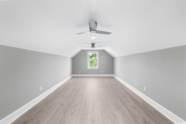 additional living space featuring ceiling fan, light hardwood / wood-style floors, and lofted ceiling