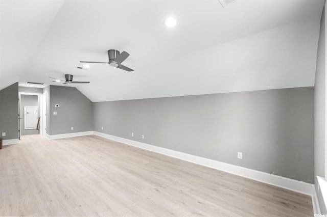 additional living space featuring light hardwood / wood-style flooring, ceiling fan, and lofted ceiling