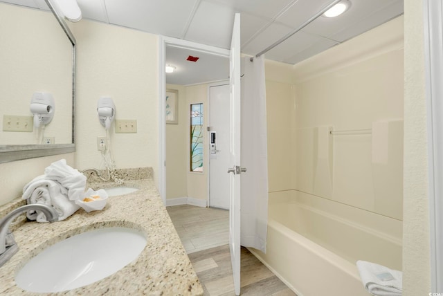 bathroom with vanity, wood-type flooring, and shower / bath combination