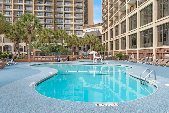 view of swimming pool with a patio