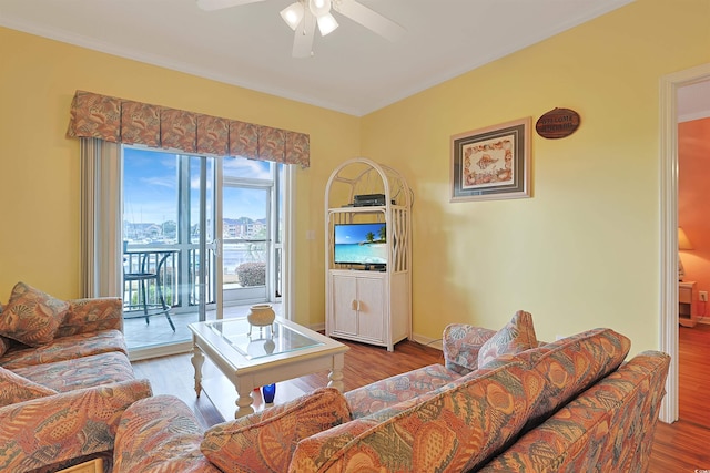 living room featuring ceiling fan and wood-type flooring