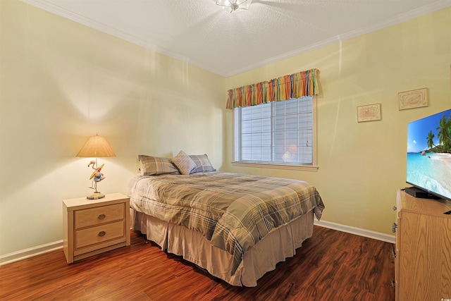 4240 Coquina Harbour Dr Unit E-4, Little River, SC 29566 - bedroom with baseboards, a textured ceiling, crown molding, and dark wood finished floors