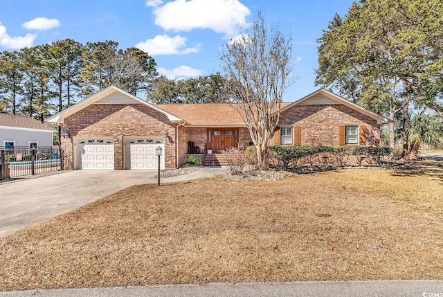 ranch-style house featuring brick siding, concrete driveway, a front yard, fence, and a garage