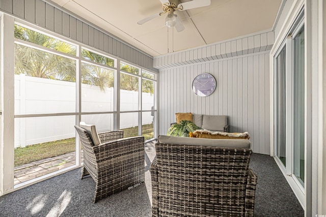 sunroom featuring ceiling fan