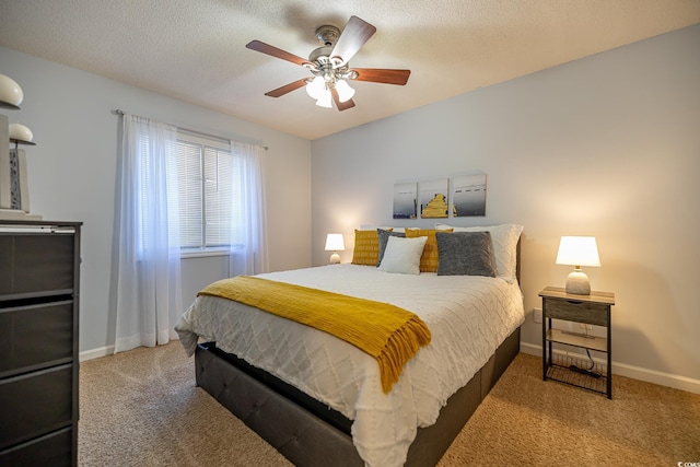 carpeted bedroom featuring a textured ceiling and ceiling fan