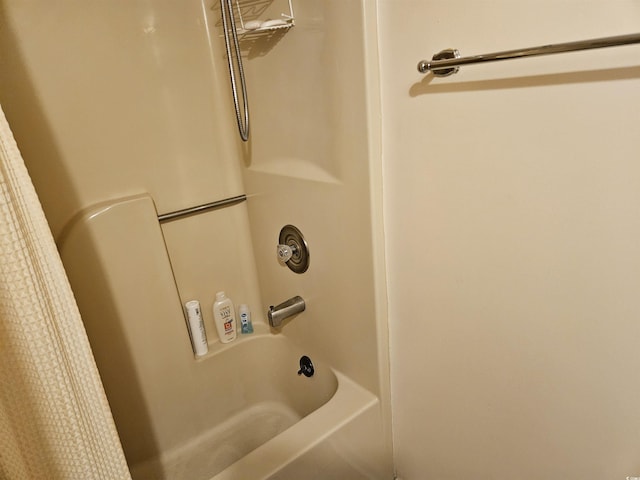 bathroom featuring shower / bathtub combination with curtain