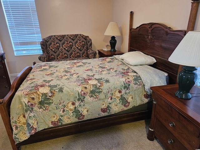 bedroom featuring light colored carpet